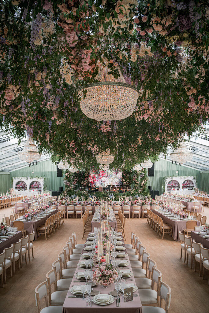 Stunning luxury Las Vegas wedding reception at the Smith Center with hanging floral arrangements and chandeliers